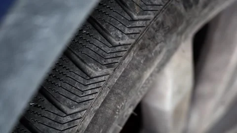 Close-Up of Car Tire with Subtle Camera Movement in 4K Stock Footage 311072126