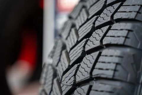 Close up of car tire tread pattern on display. Stock Photos