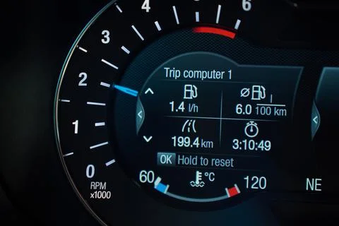 Close-up of a car trip computer and tachometer display Stock Photos