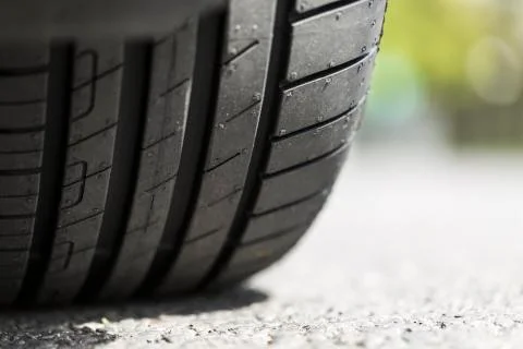 Close up of car tyre tread on the road Stock Photos