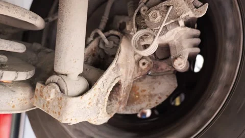 Close up of car wheel spinning and rusty brake disc system Stock Footage 346411008