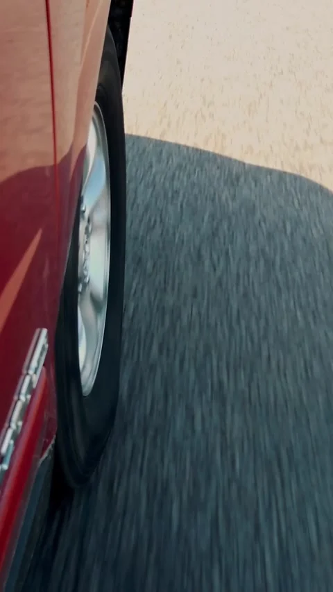 Close-up. car wheel while driving. car shadow on the road. Stock Footage 320346698