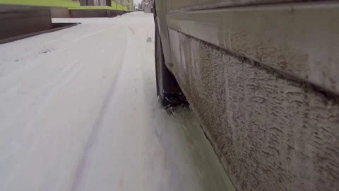 Close up of car wheel on winter road Stock Footage 146464454