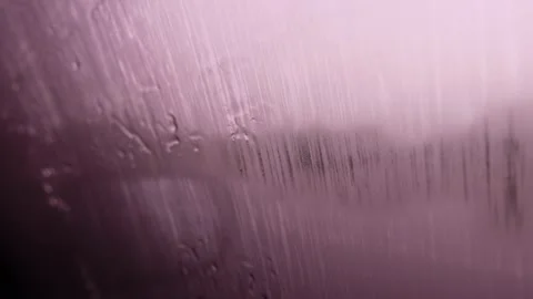 Close up of a car window that has become fogged up due to rain Stock Footage 274925100