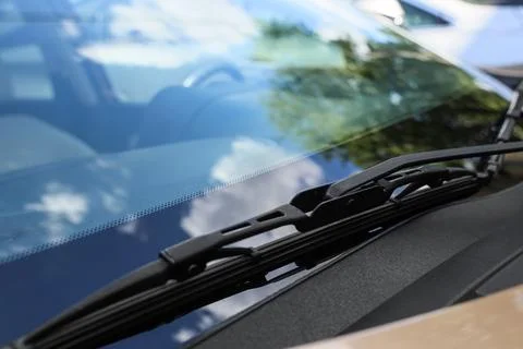 Close-up of car windshield wiper with reflections Stock Photos