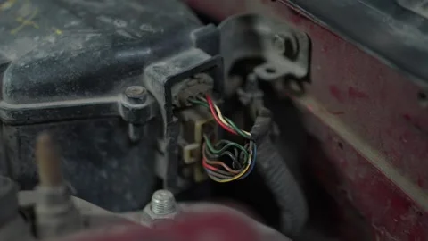 Close-up of a car wiring harness connector under the hood. Stock Footage 345708622