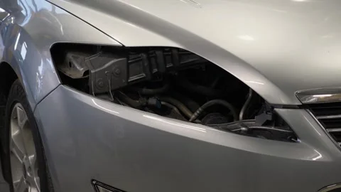 Close-up of a car without a headlight at a service station. Stock Footage 297839137