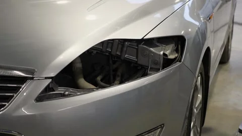 Close-up of a car without a headlight at a service station. Stock Footage 339788116