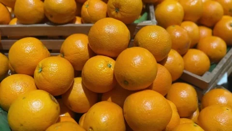 Close-up of Cara oranges with a vibrant reddish-orange peel Stock Footage 312094911