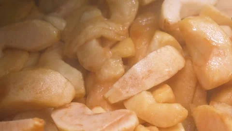 Close-up of Caramelized Apple Pie Filling Simmering in a Pan Stock Footage 337751335