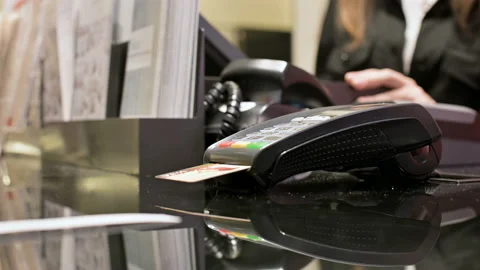 Close-up card reader for credit card payment. Woman's hand tears off a check Stock Footage 104167309