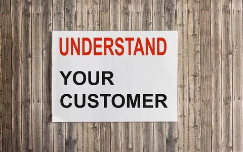 Close up on card text UNDERSTAND YOUR CLIENT, image business concept on woode Stock Photos