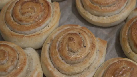 Close-up of cardamom buns on baking pan Stock Footage 131210738