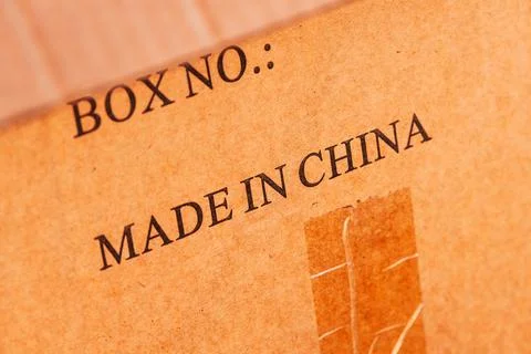 Close-up of cardboard box surface with printed Made in China text, shipping.. Stock Photos