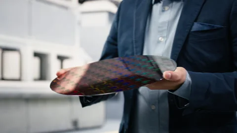 Close up of careful hardware designer carrying semiconductor substrates Stock Footage 333394769