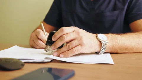 Close up carefully reading contract terms of conditions, putting signature on Vidéo 174327238