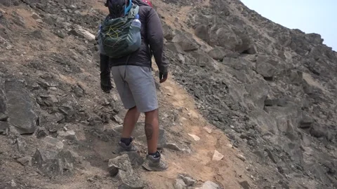 Close-up carefully walking on a hill doing trekking  Stock Footage 145149615