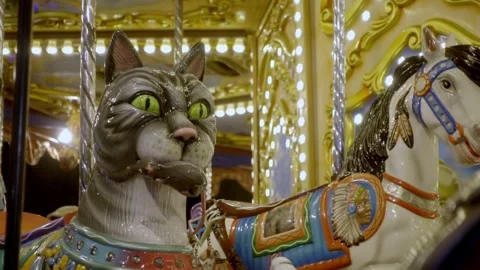Close up of carousel cat figure with horse during festival ride in Cholula Stock Footage 340812440