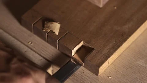 Close-up of Carpenter Chiseling a Mortise for Multiple Mortise and Tenon Joint Stock Footage 295074260
