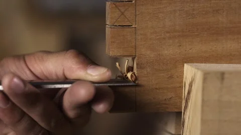 Close-up of Carpenter Chiseling a Mortise for Multiple Mortise and Tenon Joint Stock Footage 295074282