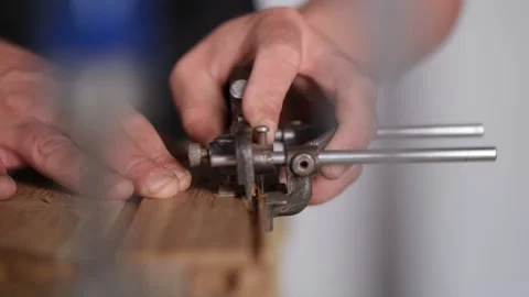 Close up. a carpenter cuts cuts in an oak board with a tongue-and-groove. car Stock Footage 144244781