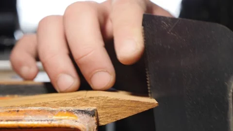 Close-up. the carpenter cuts the slots with a hand saw. sawing teeth Vídeos de archivo 156669696