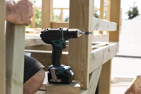 Close up of a carpenter with drilling machine Stock Photos