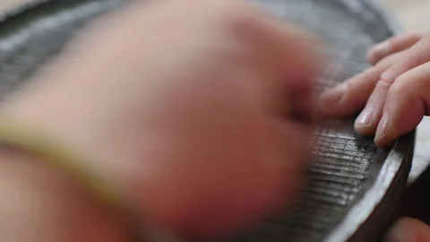 Close-up. a carpenter is grinding a bog oak board with sanding paper. carpent Stock Footage 144243601