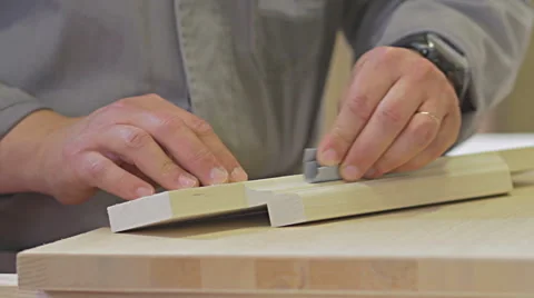 Close up of carpenter. Joiniter sanding a wood. Hand made. Video stock 63898529
