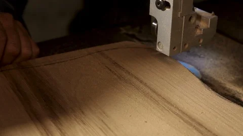 Close - up of a carpenter on the machine cuts wood along the line Stock Footage 100745917
