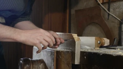 Close up, carpenter makes a hole by using tip turning loving Stock Footage 97457101