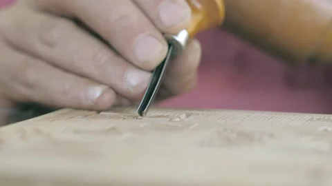 Close-up. carpenter makes wood carving with a chisel and mallet. Carpentry, c Stock Footage 139446580