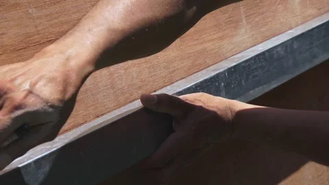 Close-up of Carpenter Measuring and Marking Plywood with Ruler and Pen Stock Footage 331654827