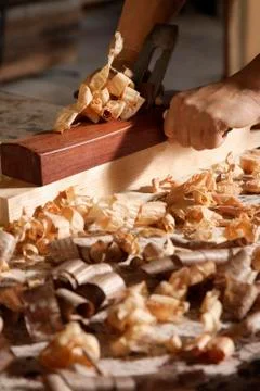 Close up of carpenter using a block plane. Stock Photos