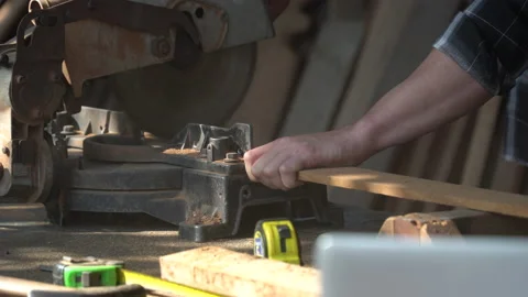 Close up carpenter using circular saw cutting wooden plank in workshop . Youn Stock Footage 149984879