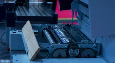 Close-up of a carpenter using a circular saw to cut a large board of wood Stock Photos