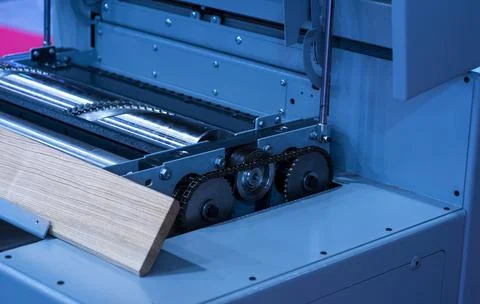 Close-up of a carpenter using a circular saw to cut a large board of wood Stock Photos