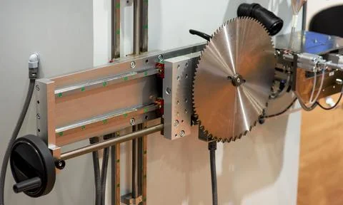 Close-up of a carpenter using a circular saw to cut a large board of wood Stock Photos