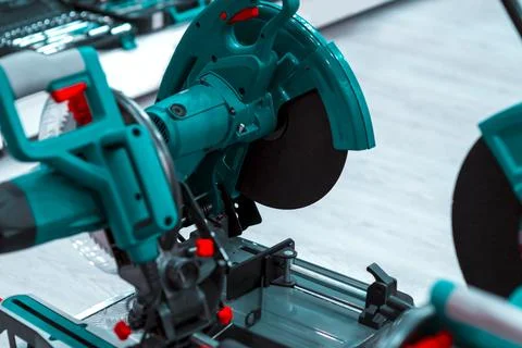 Close-up of a carpenter using a circular saw to cut a large board of wood Stock Photos