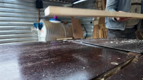 Close-Up of Carpenter Using a Jointer Planer Machine. A professional woodwo.. Stock Footage 332005160