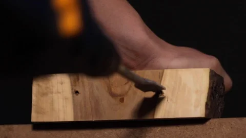 Close up of a carpenter using a special drill to create a large hole in a Video stock 122739092