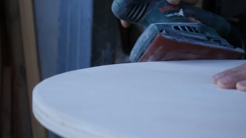 Close up of carpenter that work on woodworking using electric sander for wood. Stock Footage 99781531