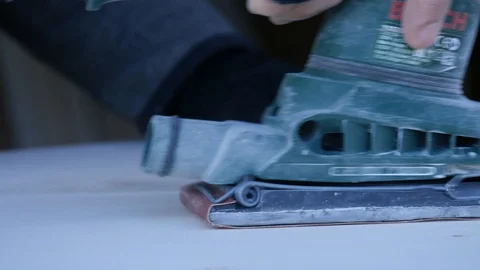 Close up of carpenter that work on woodworking using electric sander for wood. Stock Footage 99781533