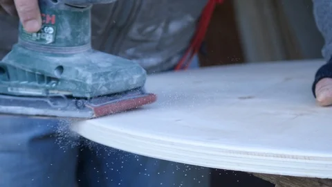 Close up of carpenter that work on woodworking using electric sander for wood. Stock Footage 99781586