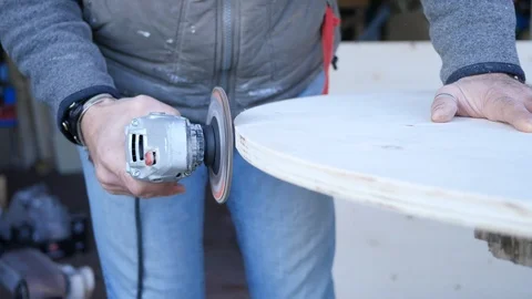 Close up of carpenter that work on woodworking using electric sander for wood. Stock Footage 99782160