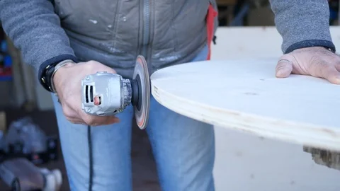 Close up of carpenter that work on woodworking using electric sander for wood. Stock Footage 99782183