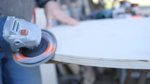 Close up of carpenter that work on woodworking using electric sander for wood. Stock Footage 99782501