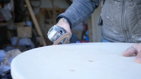 Close up of carpenter that work on woodworking using electric sander for wood. Stock Footage 99783011