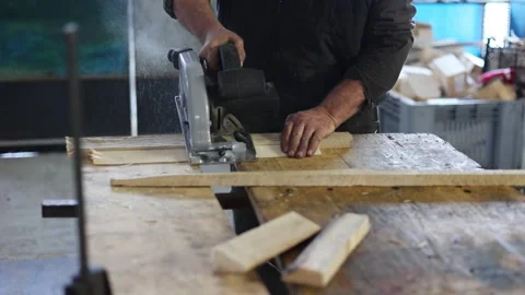 Close-up of a carpenter working circular saw in a workshop. Stock Footage 274155683