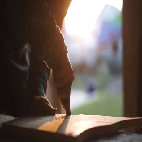 Close-up of a Carpenter working on a Wooden Window Frame with a File in his Stock Footage 69541016